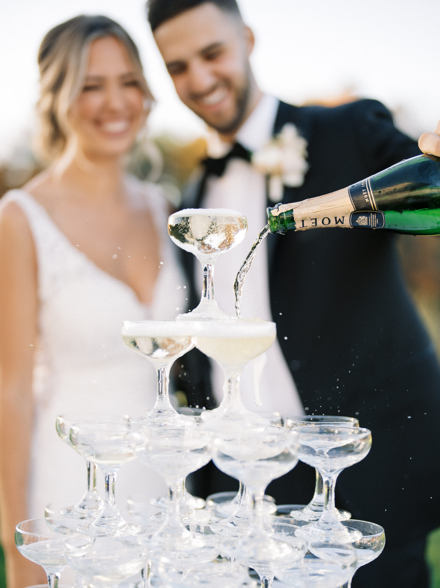 couple pouring champagne